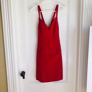 Red form fitting cocktail dress, stitch detail